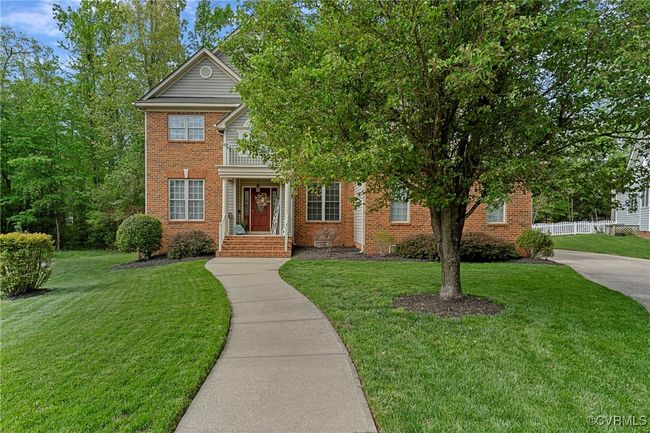 View of front of house featuring brick siding and a front lawn | Image 49