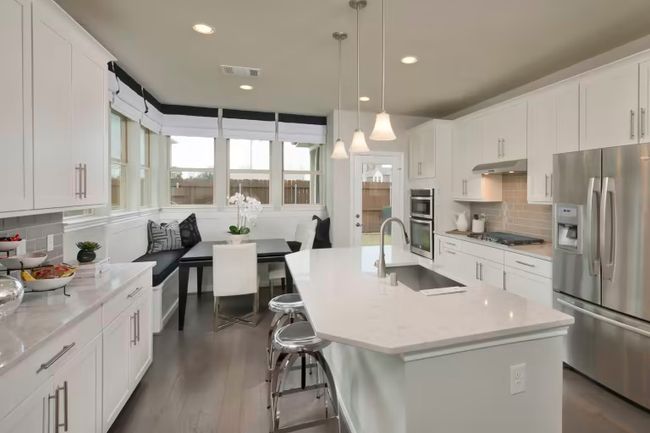 Photo of Pulte model home with same floor plan, not of actual home listed. | Image 6