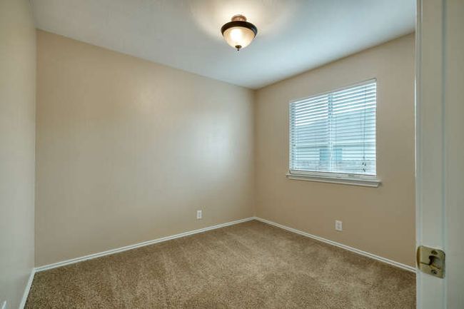 Carpeted spare room with baseboards | Image 12