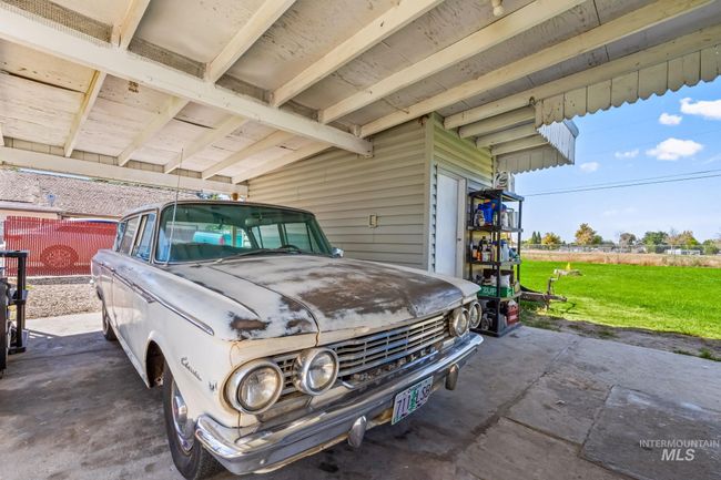 Garage featuring an attached carport | Image 21