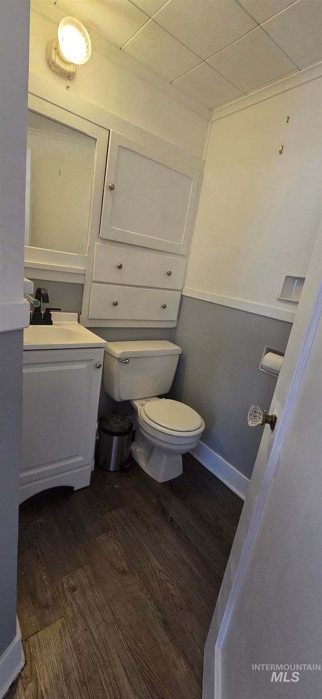 Half bathroom with wood finished floors and vanity | Image 20