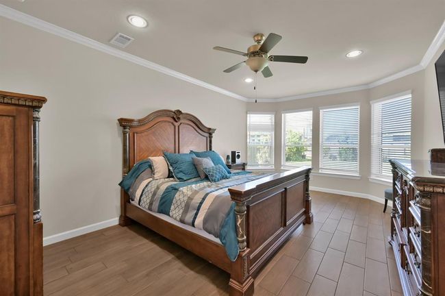 If you're wanting a LARGE 17 X 13 primary retreat featuring bay windows, crown molding, and tile floors... you're in luck. This home is so PERFECT you may even want to go ahead and schedule that showing. | Image 15