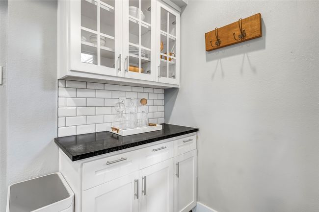 Bar featuring tasteful backsplash | Image 11