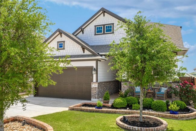 Craftsman-style home featuring a porch, a front entry attached garage | Image 10