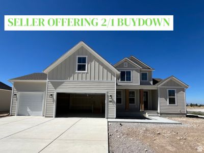 View of front facade with a garage | Image 1