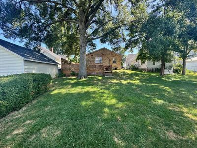 View of yard featuring a wooden deck | Image 2