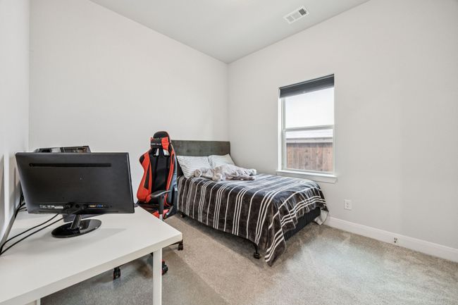 Bedroom featuring carpet floors and baseboards | Image 11