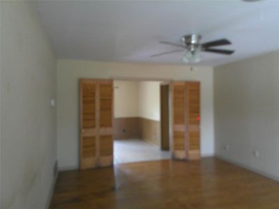 Spare room with ceiling fan | Image 2