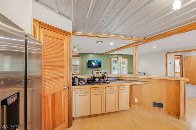 Kitchen with freestanding refrigerator, light wood-type flooring, and recessed lighting | Image 16