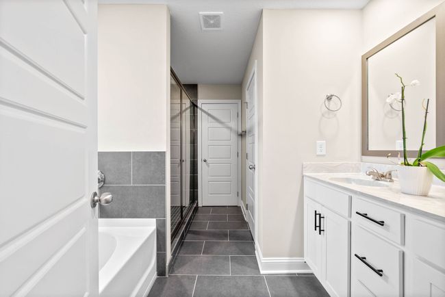 Separate tub and shower, double vanities, gorgeous tile work and large walk in closet in the primary bath! | Image 22