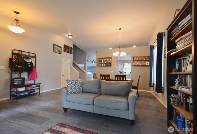 Formal Living room, has huge windows with lots of that PNW sunshine coming in. Laminate floors on main and lower level of home | Image 6
