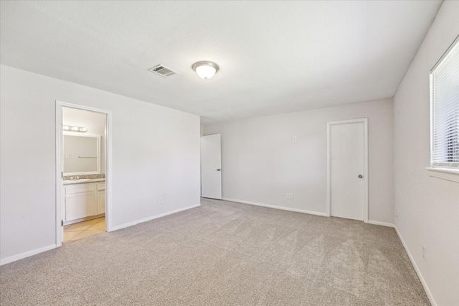 Second view of primary bedroom with en-suite bath. | Image 13