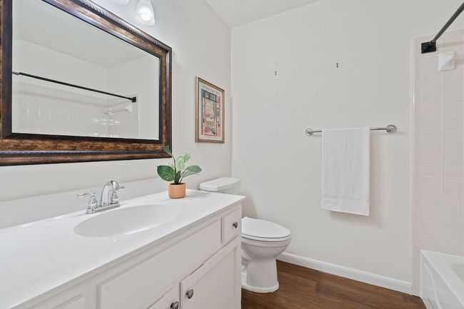 the full secondary bathroom is well maintained and ready to use with a shower/tub combo and single vanity. | Image 29