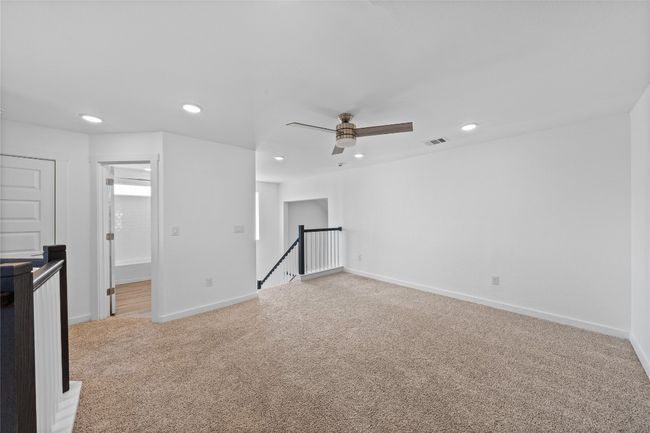 Empty room featuring light carpet, baseboards, visible vents, and recessed lighting | Image 23