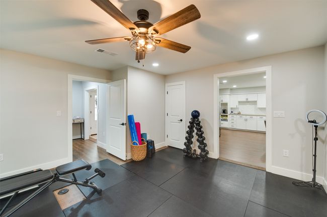 Workout room featuring baseboards, visible vents, a ceiling fan, and recessed lighting | Image 9