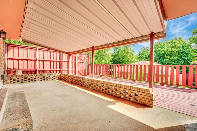 Fenced backyard with a patio area | Image 20