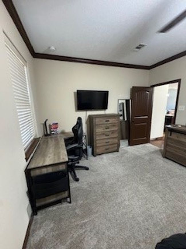 Office space with ornamental molding and carpet flooring | Image 20