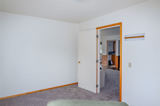 Carpeted bedroom with baseboards | Image 93