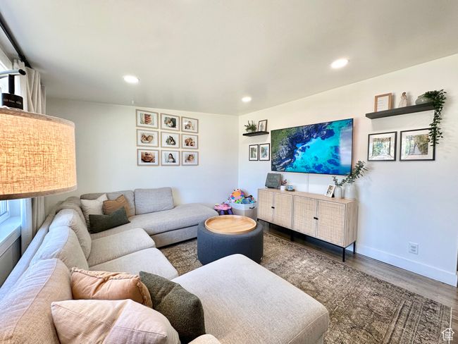 Living room with wood finished floors and recessed lighting | Image 4