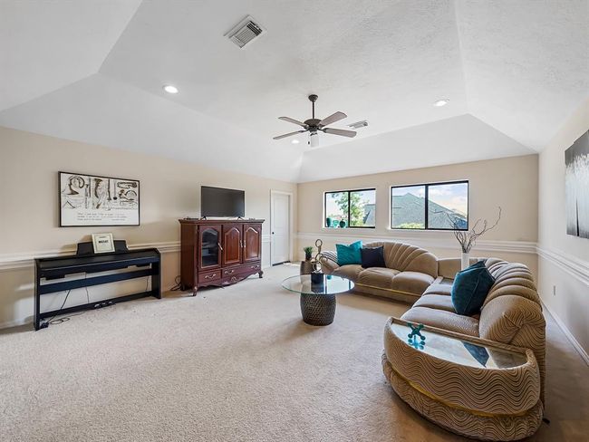 Expansive upstairs game room perfect for entertainment and relaxation. | Image 34