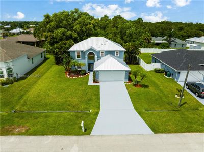 6450 Nw Hacienda Ln, House other with 5 bedrooms, 3 bathrooms and null parking in Port St. Lucie FL | Image 3