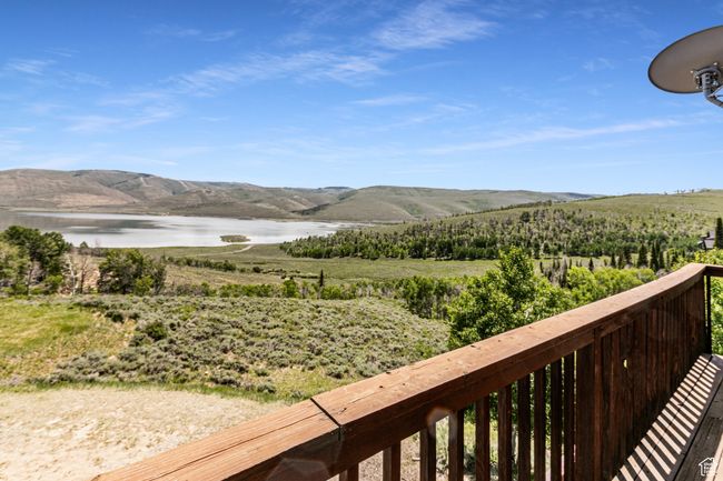 View of mountain backdrop with a large body of water | Image 18