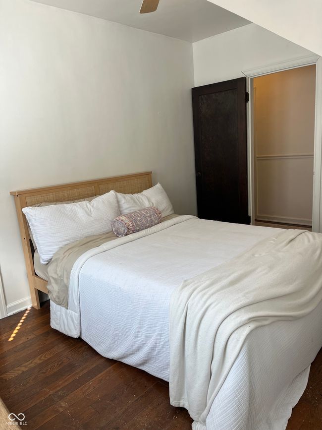 bedroom with hardwood / wood-style floors and ceiling fan | Image 11