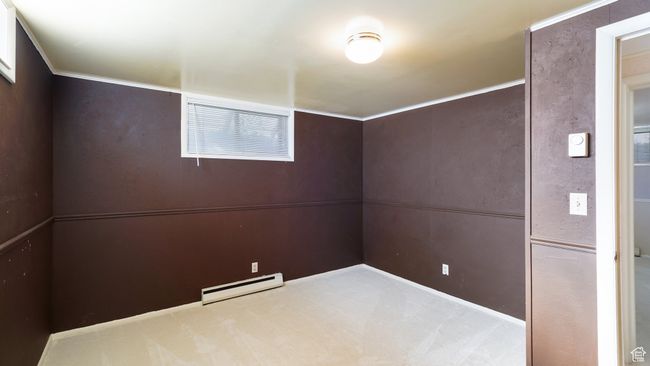 Empty room featuring baseboard heating and carpet flooring | Image 19