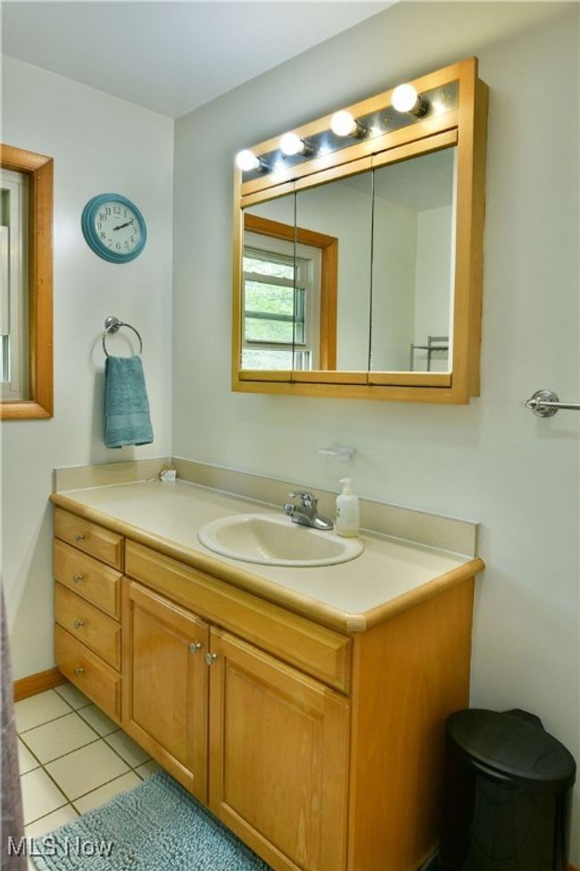 Bathroom featuring vanity and tile patterned floors | Image 20