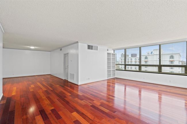 Fifth floor corner unit with lots of natural light and woodfloors. | Image 14