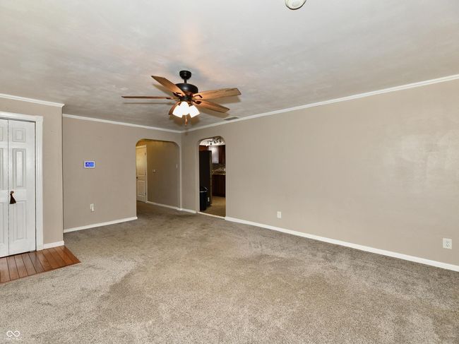 Living room, doorway to kitchen and hallway. | Image 9