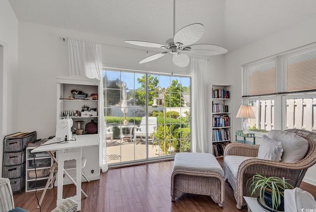 Additional Flex space/Sitting room, just off the Living Room with ceiling fan, wood finished floors, and high vaulted ceiling | Image 20