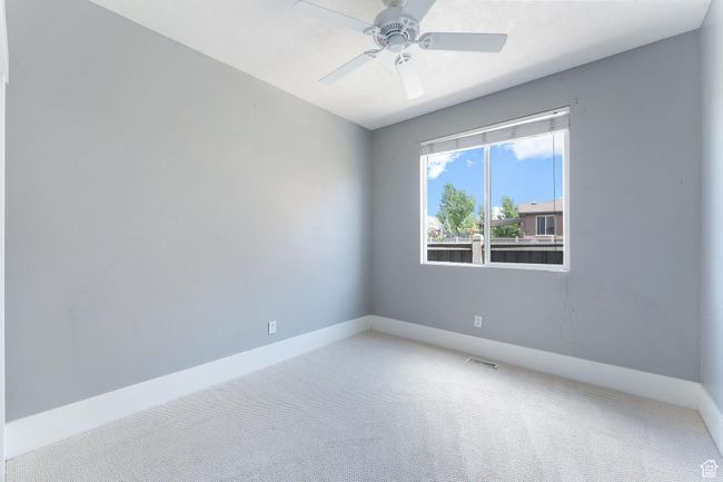 Bedroom 3 with carpet and ceiling fan | Image 23