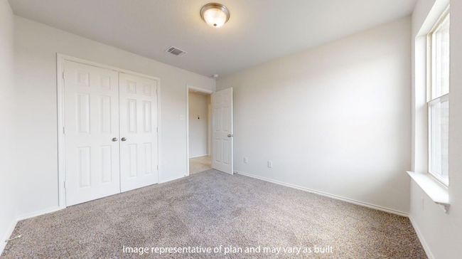 Unfurnished bedroom with carpet flooring, a closet, and baseboards | Image 18