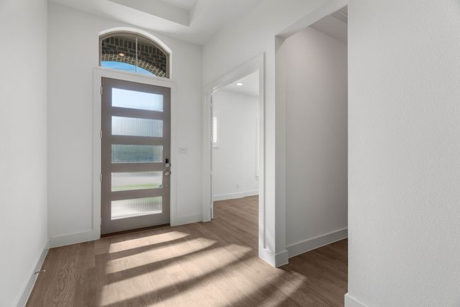 Foyer entrance with wood finished floors and baseboards | Image 6