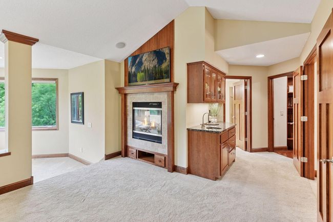 Fireplace in owners suite with beverage station, wake up with coffee | Image 33