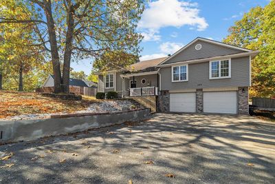 View of front of house featuring a garage | Image 1