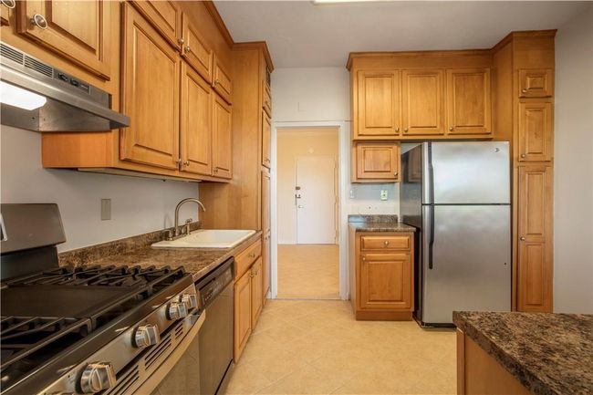 Alternative view of the spacious Kitchen with loads of cabinetry and plenty of counterspace. | Image 12