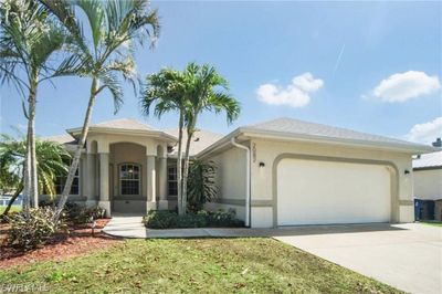 View of front facade featuring a garage | Image 1