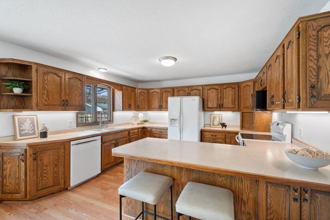 Kitchen window overlooks backyard | Image 5