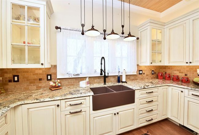 The Guest house kitchen has a beautiful apron sink, custom cabinets and such beautiful finishes. | Image 37