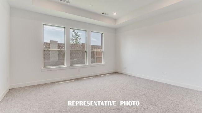 Your new owner's suite is a peaceful and relaxing space located at the rear of the home for added privacy. REPRESENTATIVE PHOTO. | Image 10