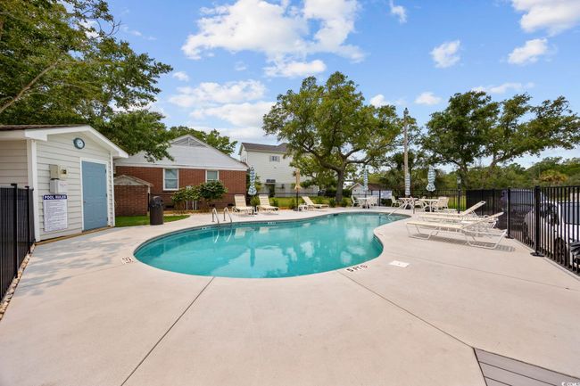 Community pool featuring a patio | Image 7