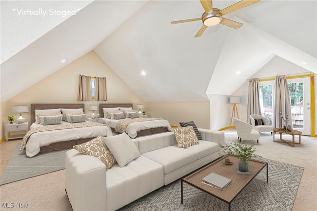 Bedroom with carpet floors and lofted ceiling | Image 30