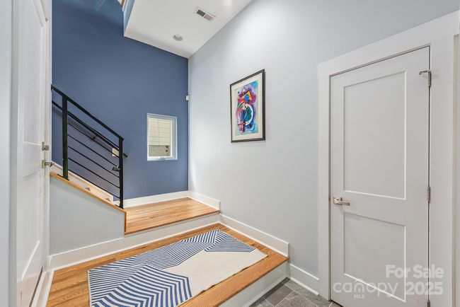 Lower level exterior entrance with storage closet and garage entrance | Image 5