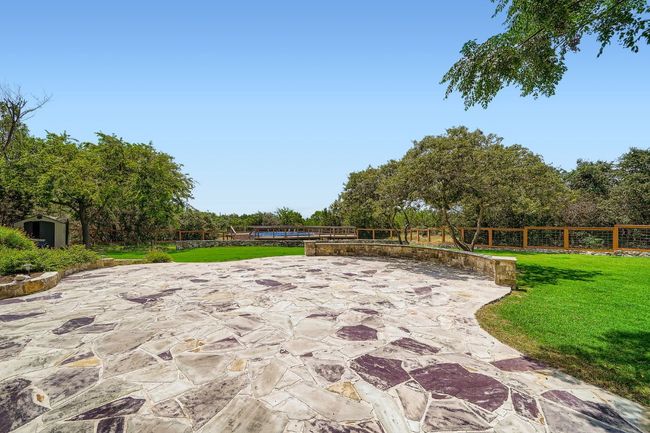 Another view of back yard w/ Silverado Mist Blue Stone patio | Image 27