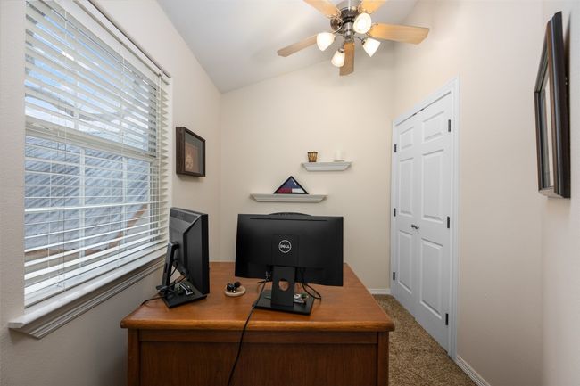 Off of the gameroom is an office. It is small, but comes with a large window, closet for supplies and a ceiling fan. | Image 23