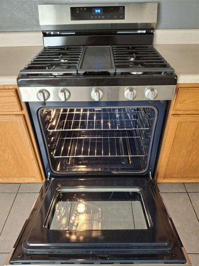 Kitchen view of gas stove | Image 17