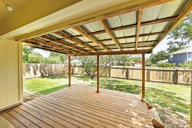 Wooden terrace featuring a fenced backyard | Image 27