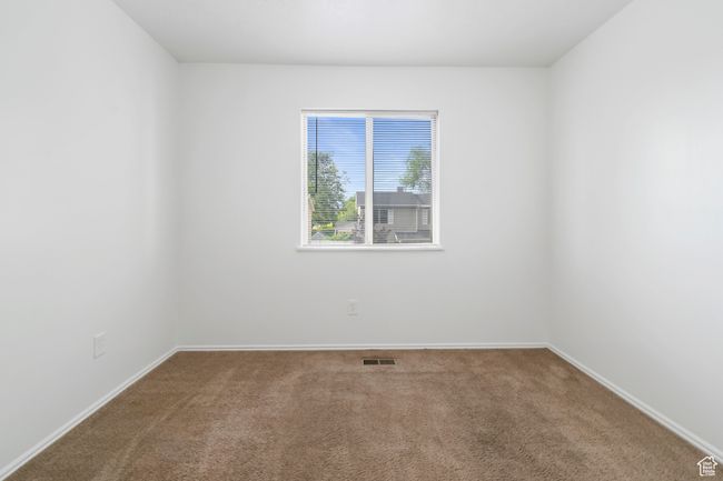Carpeted empty room with baseboards | Image 22